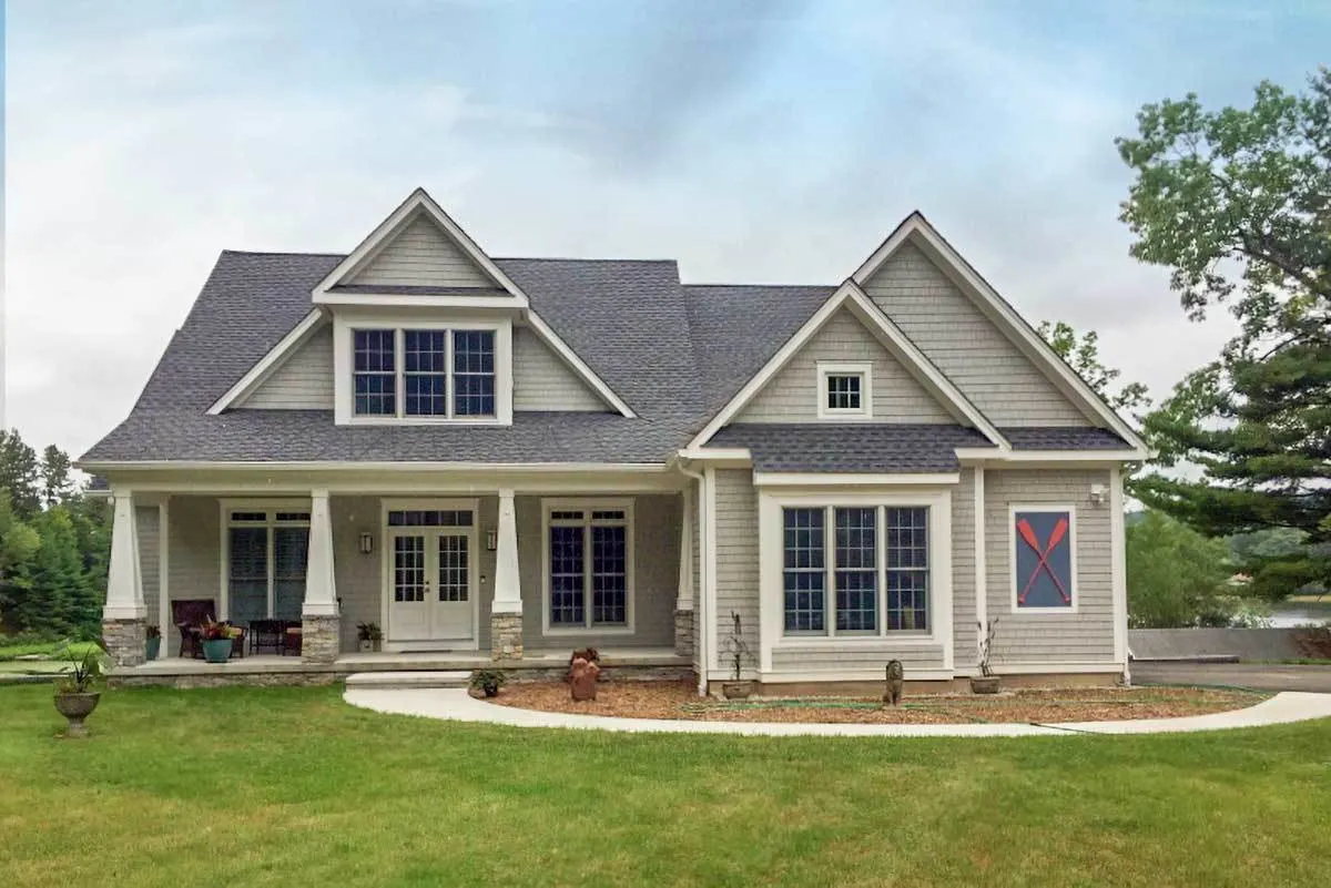 The lounges make the house's covered porch appear pleasant.