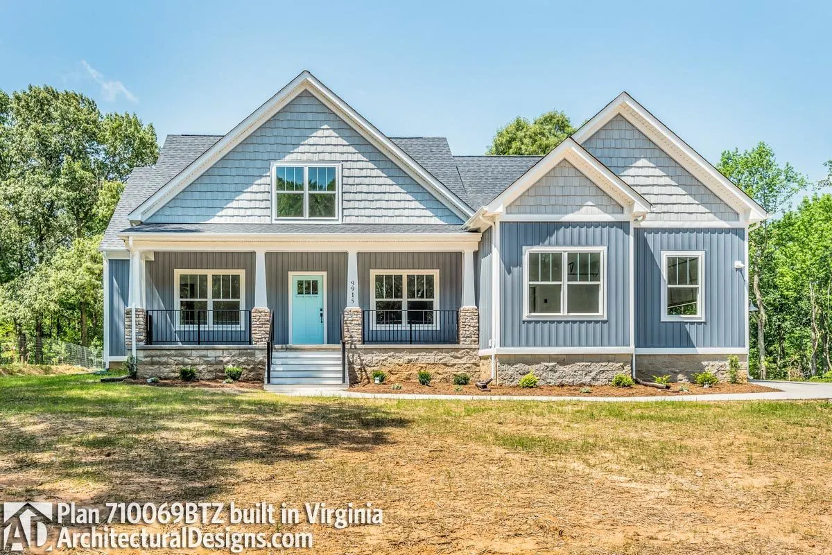 The main door's bright blue tint goes beautifully with a lovely delicate blue-painted wall.