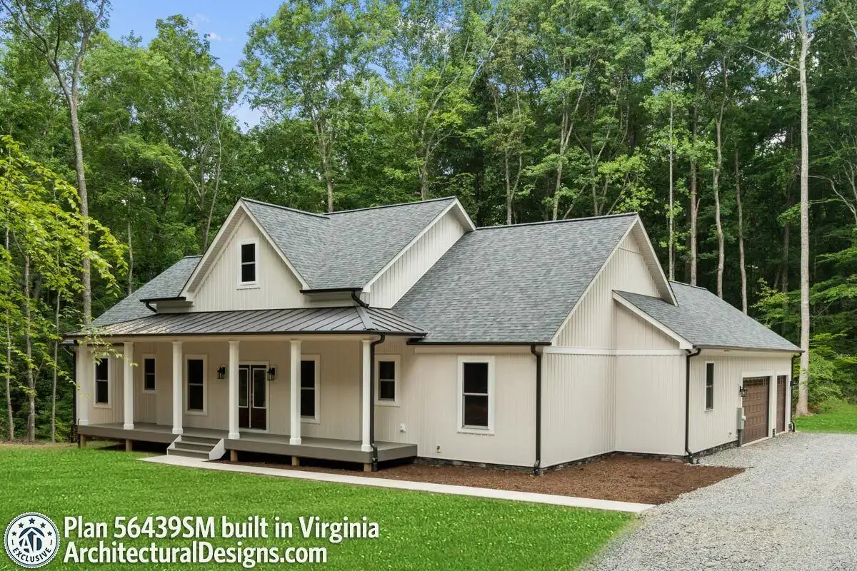 A modern farmhouse in a vibrant hue fits in with the surroundings naturally.