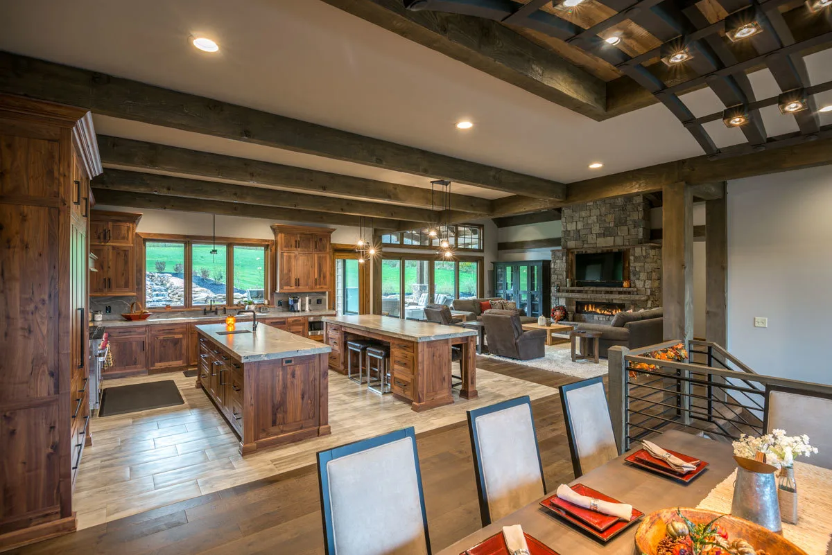 Stunning kitchen decor with two islands in the center and a wooden accent.