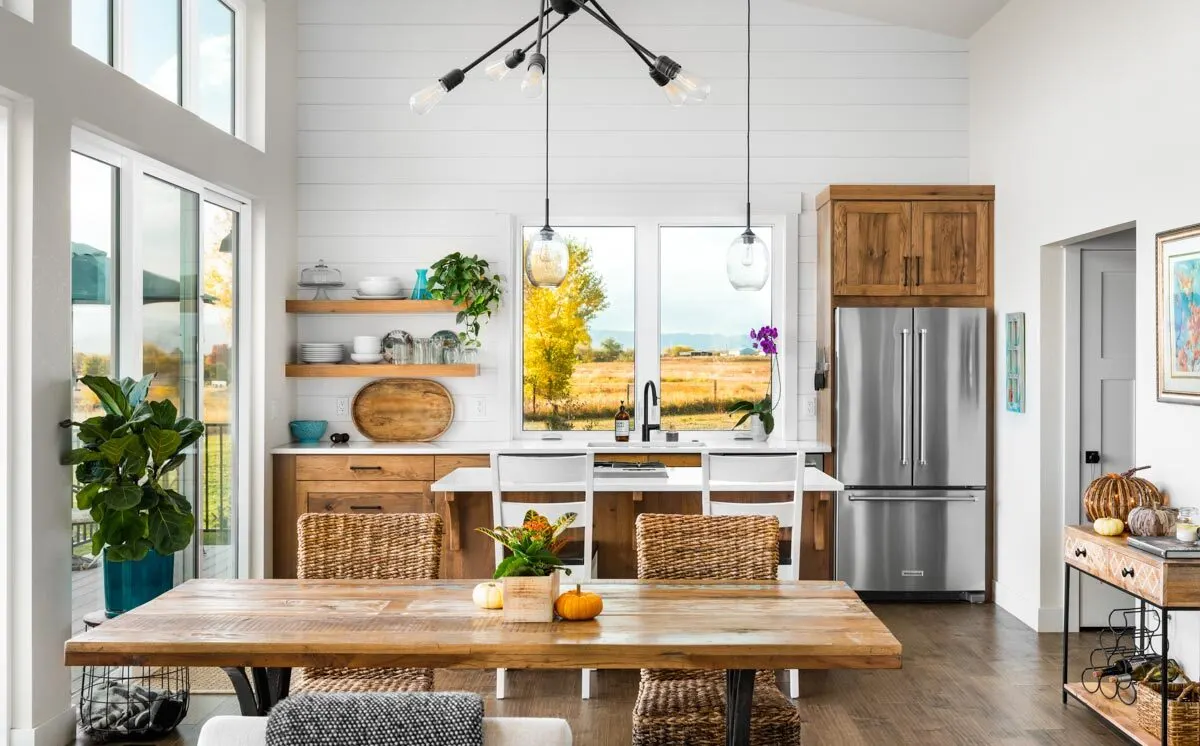 A stylish kitchen and dining room with a wooden accent.