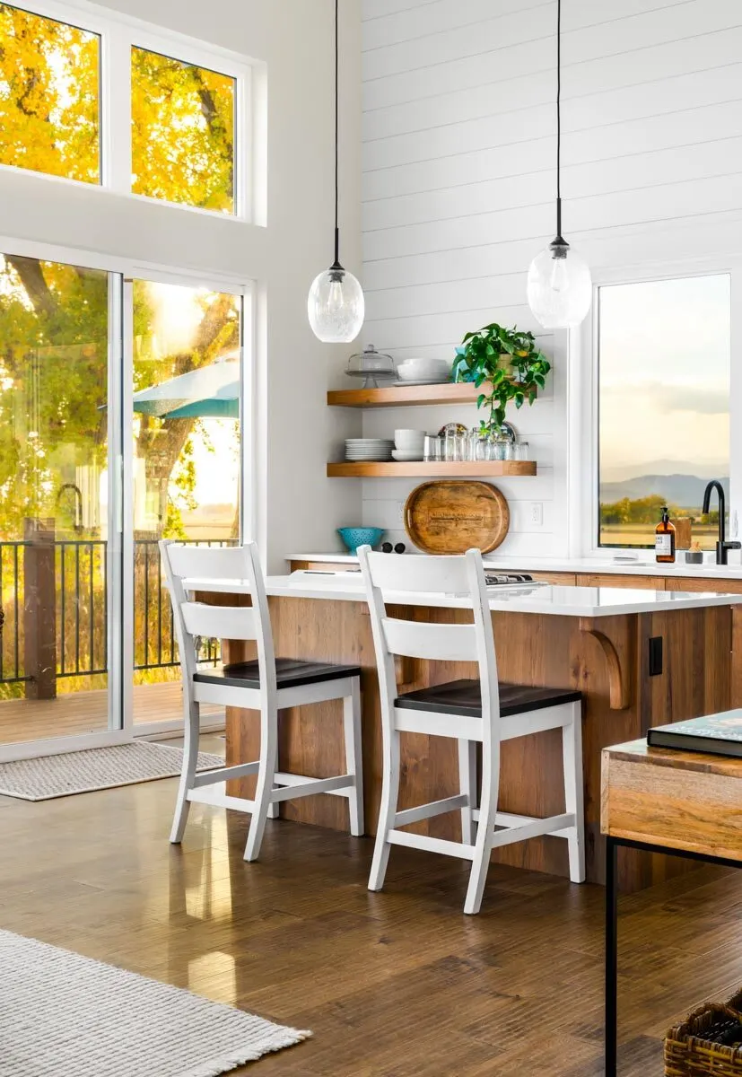 A stunning kitchen island with a white countertop and a wood foundation.