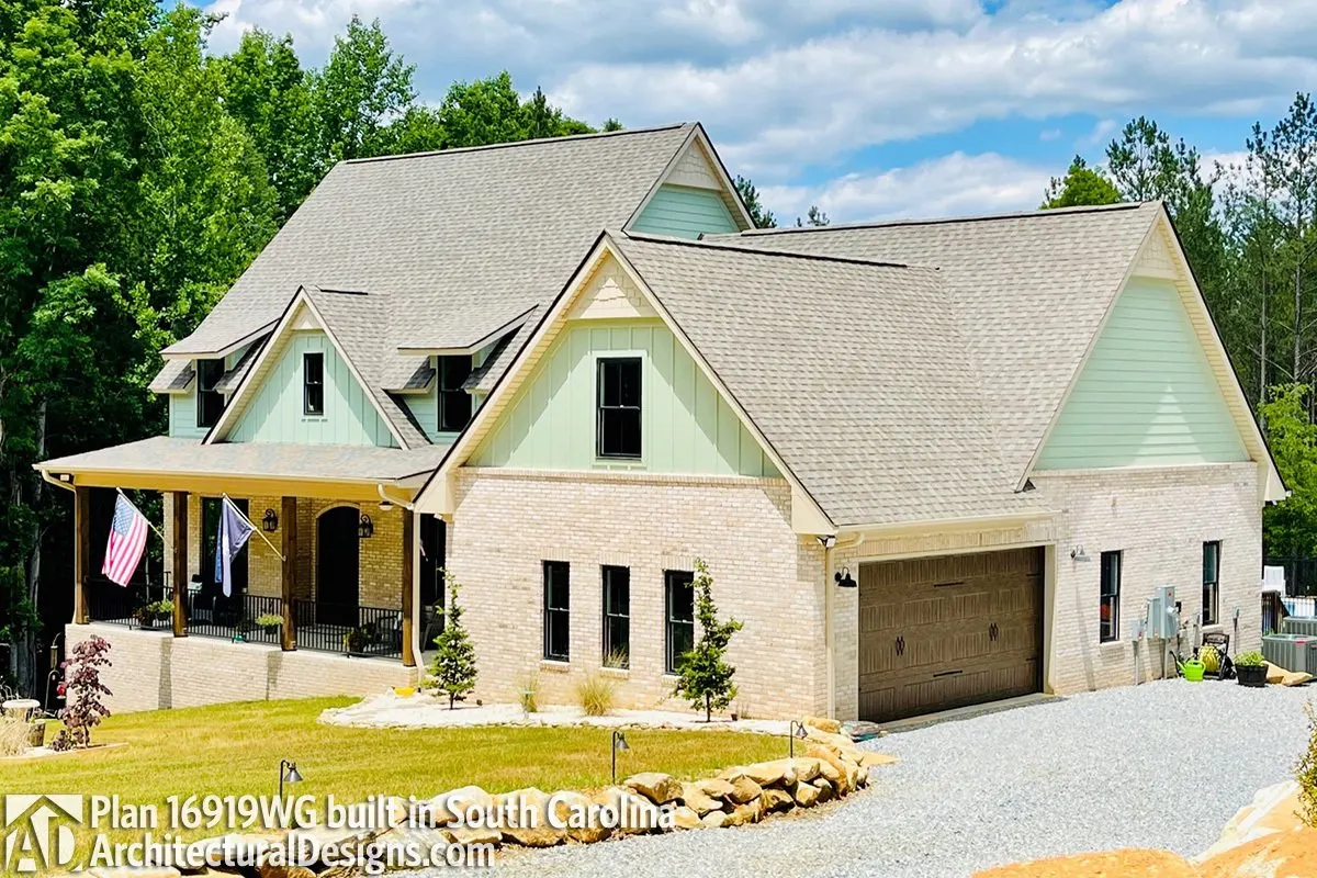 An additional modern home design that features bricks on the façade.