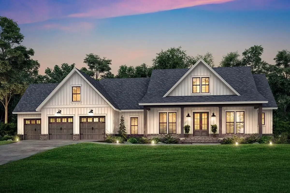 The lights on the house glow brilliantly in front of the farmhouse.
