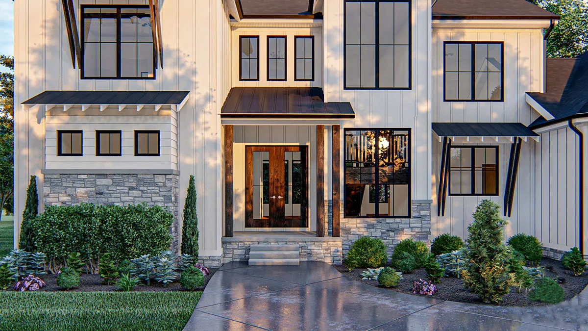 With its wooden accent door and porch pillars, the main entry has a gorgeous appearance.