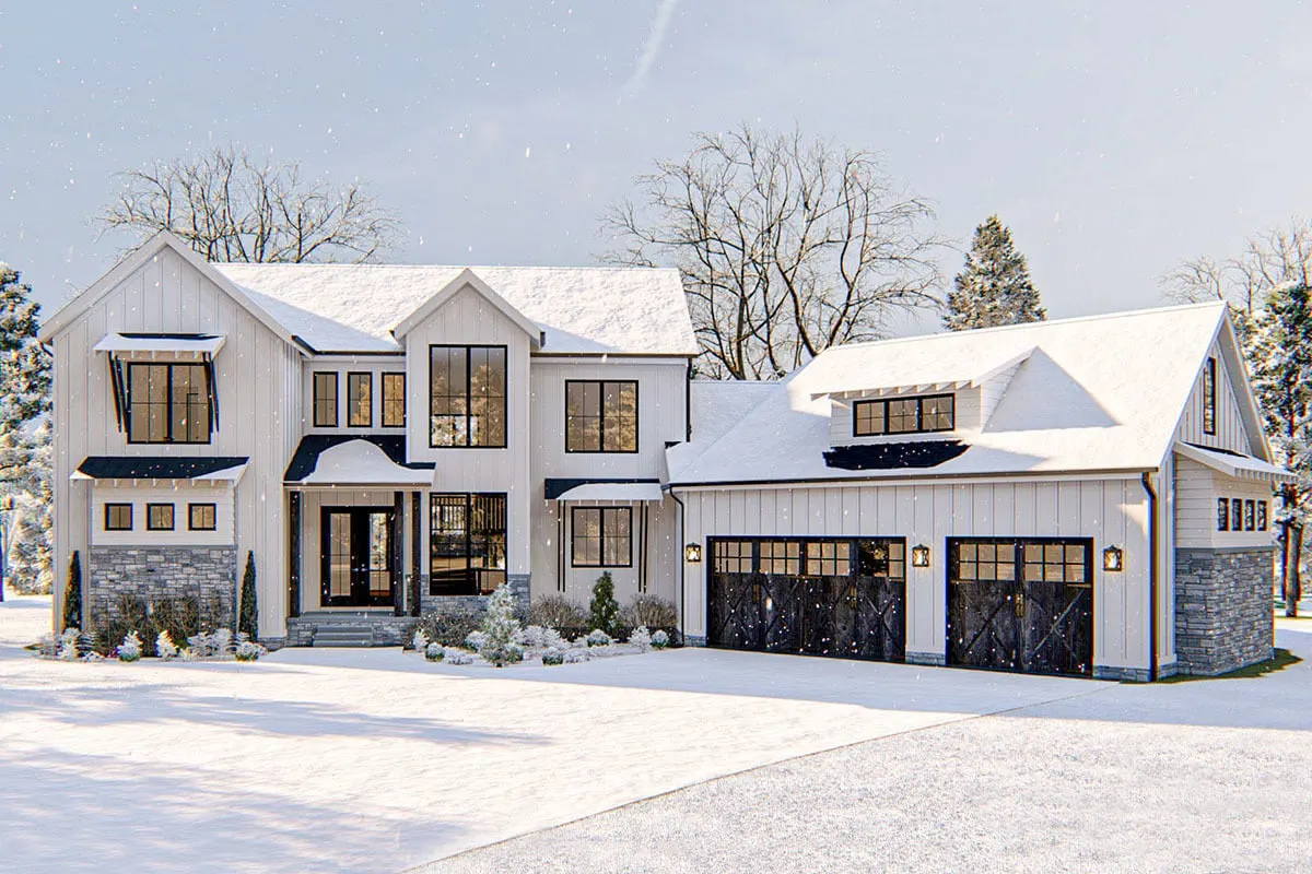 View of a  modern farmhouse in a snowy landscape.