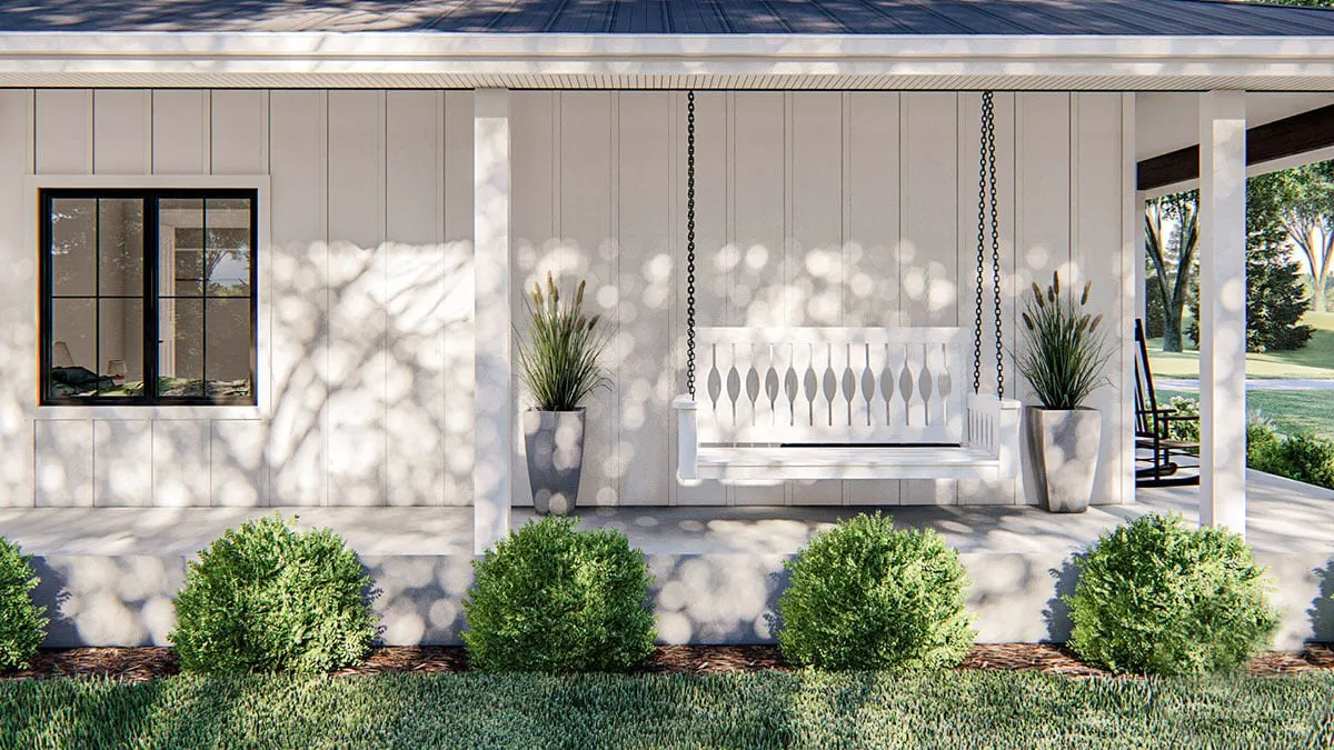 A white porch swing  A white porch swing with landscapes all around looks welcoming.