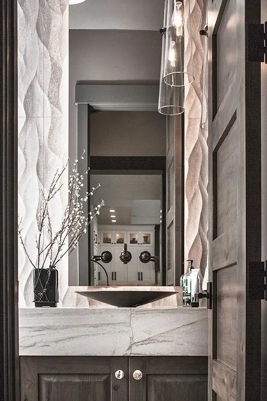 Elegant powder room with a classy black sink.