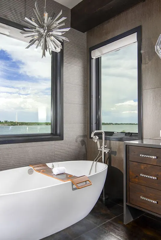Large windows near the bath and a magnificent silver chandelier