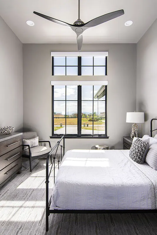 A bedroom with a minimalist black and white color scheme.