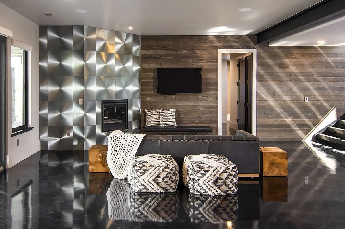 A gleaming recreational space with a built-in fireplace.