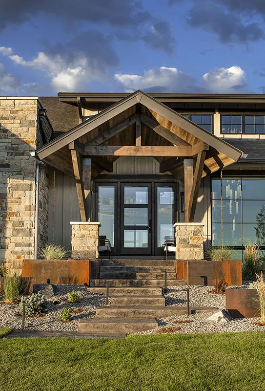 Beautiful porch with a grand open-gable entry in wooden accent design.