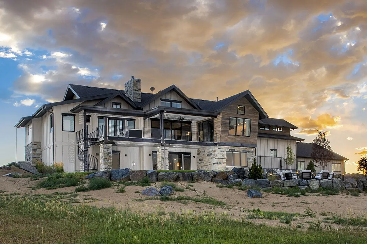 From a distance, the home appears serene against the rocky environment.