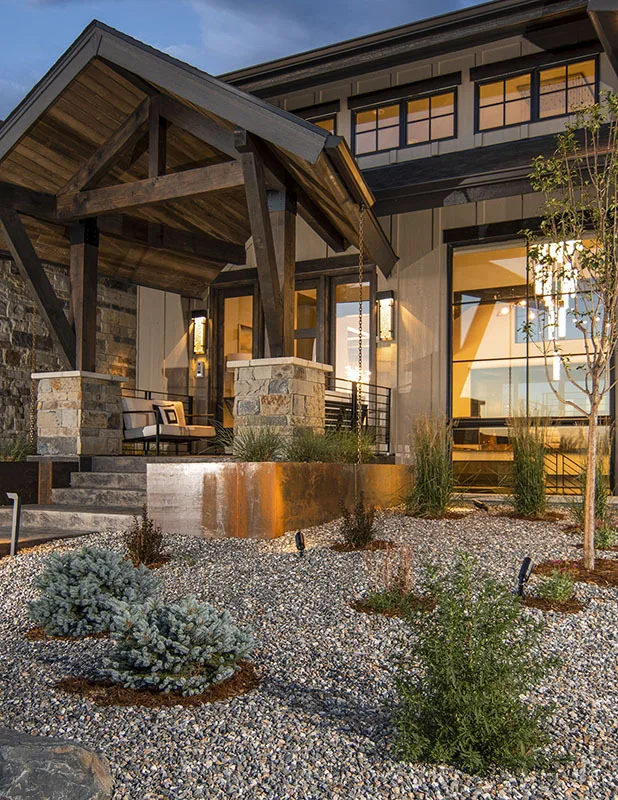 The front yard has been landscaped with stone.