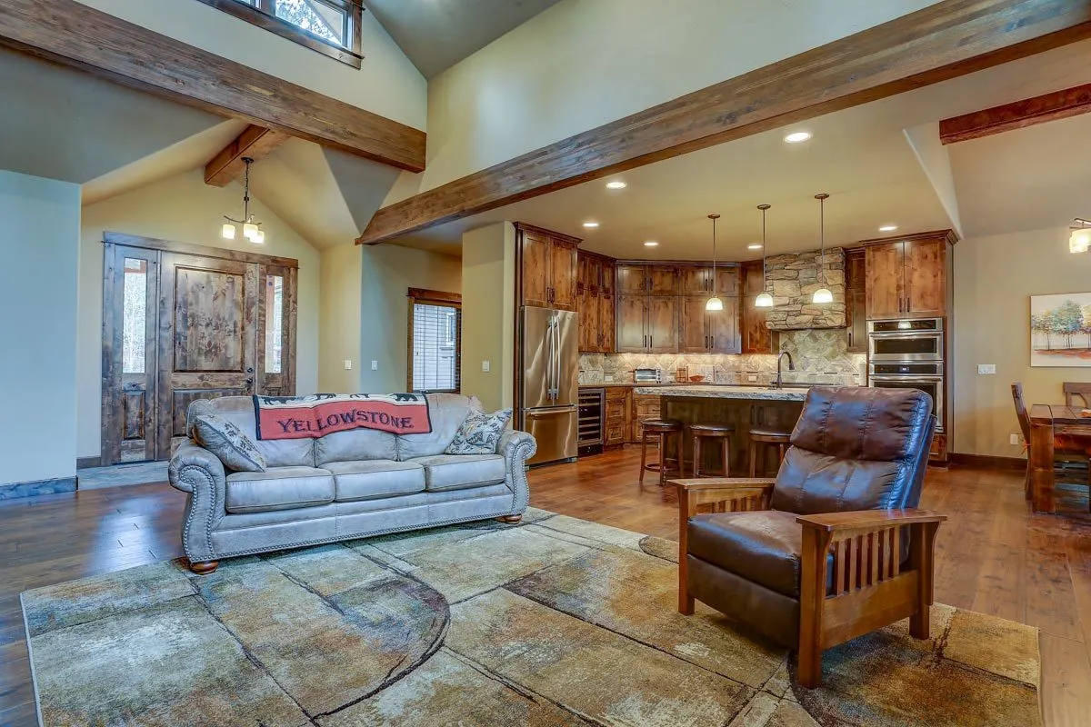 Great room area with a rustic design couch and chair. 