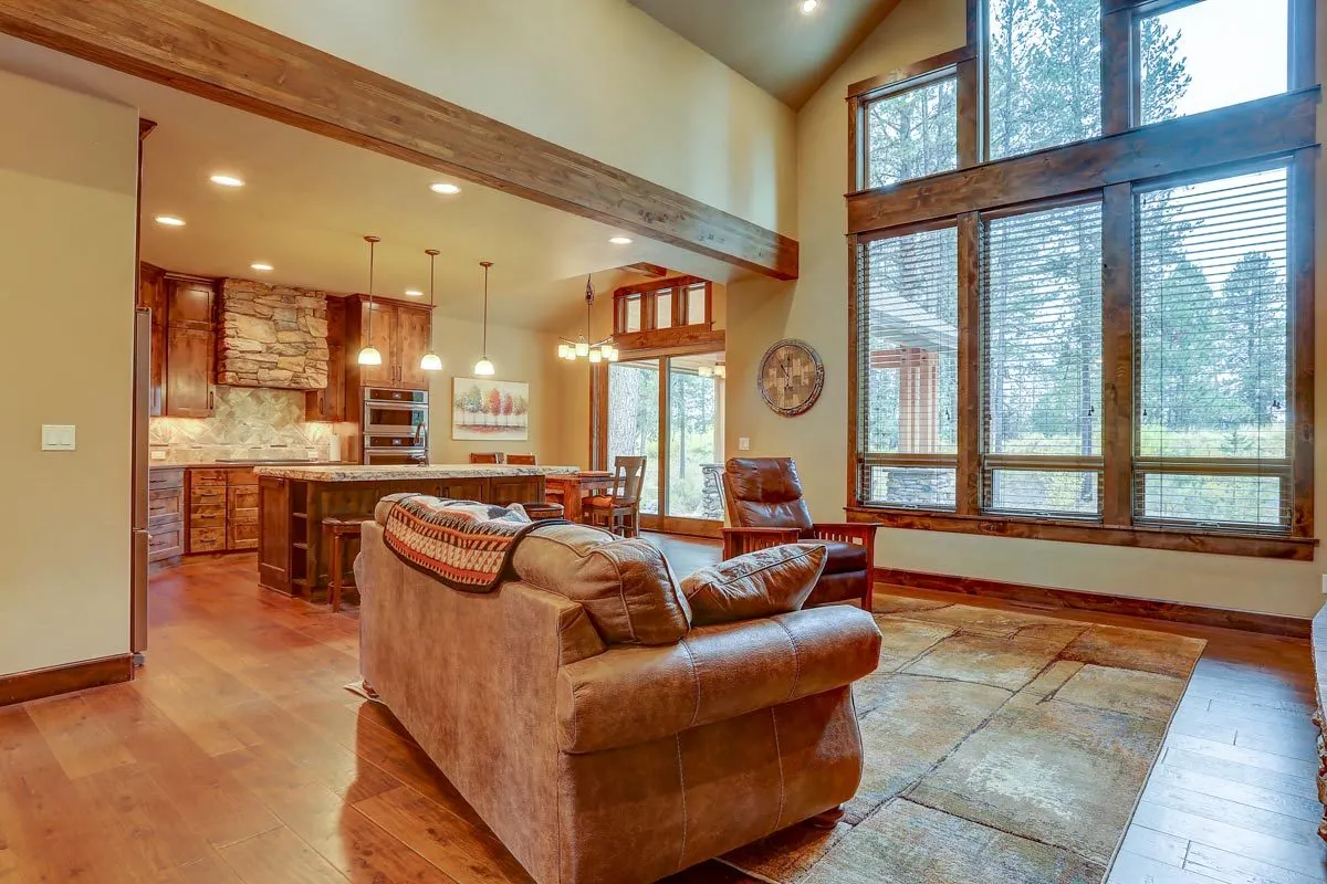 Natural light enters the living room through a large window.