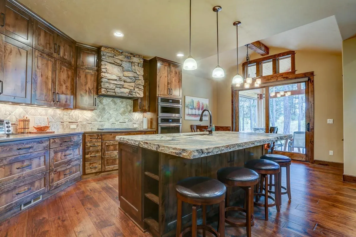 The inside of a kitchen decorated in a rustic style looks stunning.
