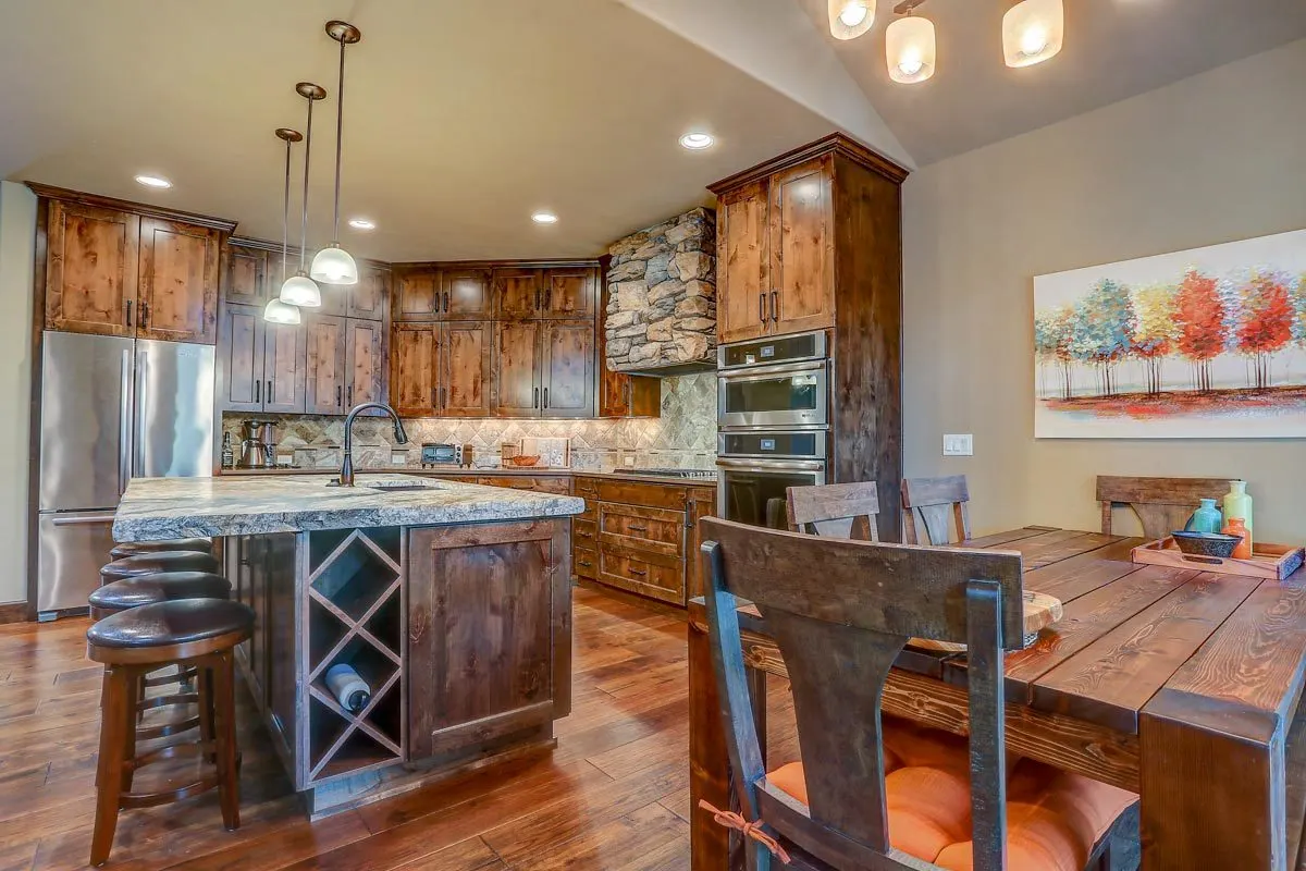 The kitchen has a stone range hood frame looks sturdy.