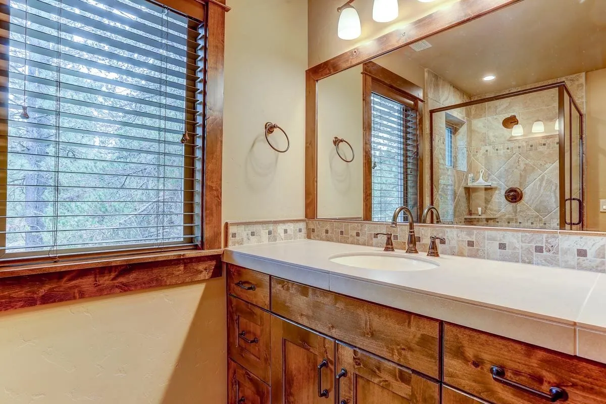 The spacious bathroom window offers a beautiful mountain outlook.
