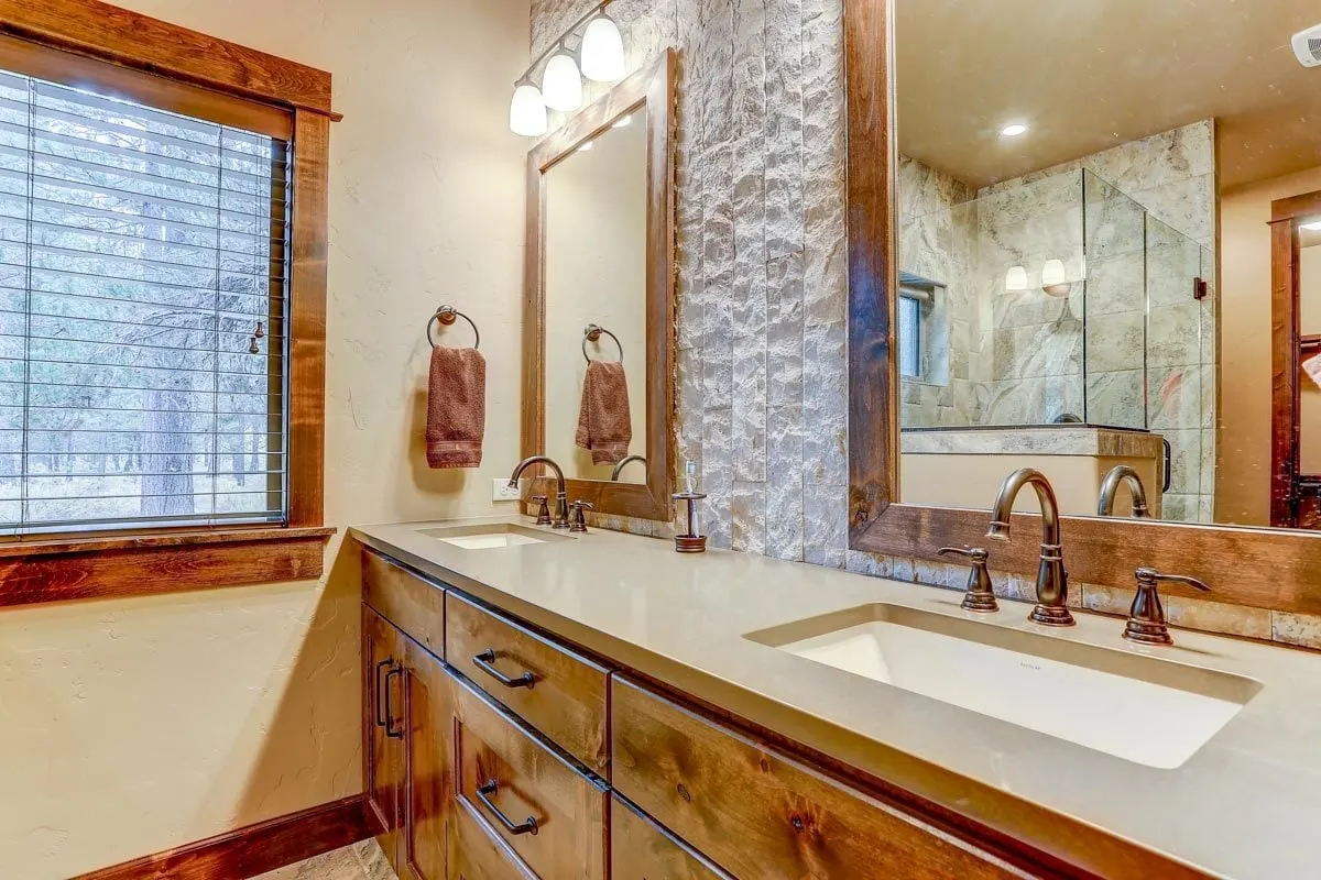 Simple off-white tile countertop in the vanities area.