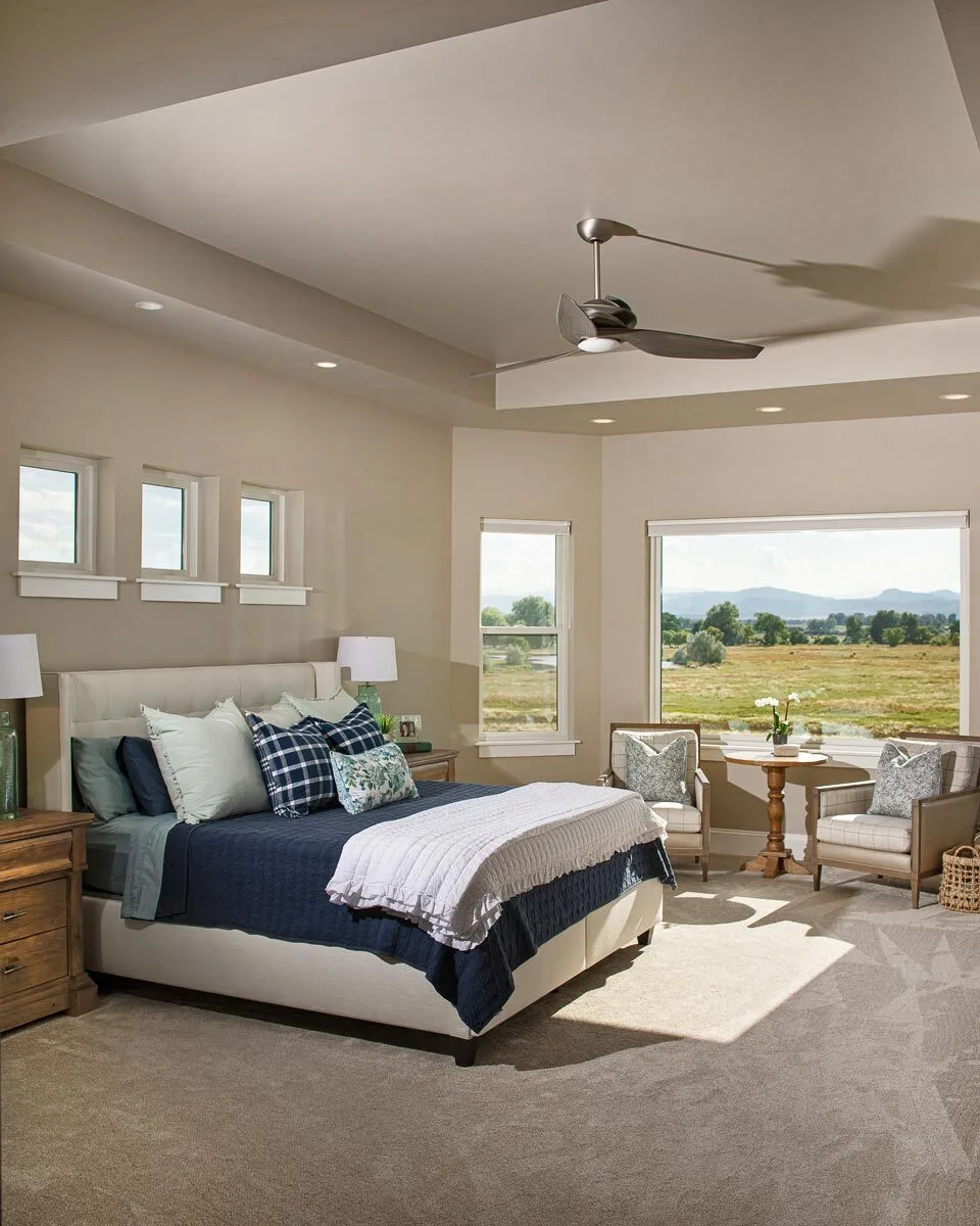 The master suite has a large room with windows for added lighting techniques.