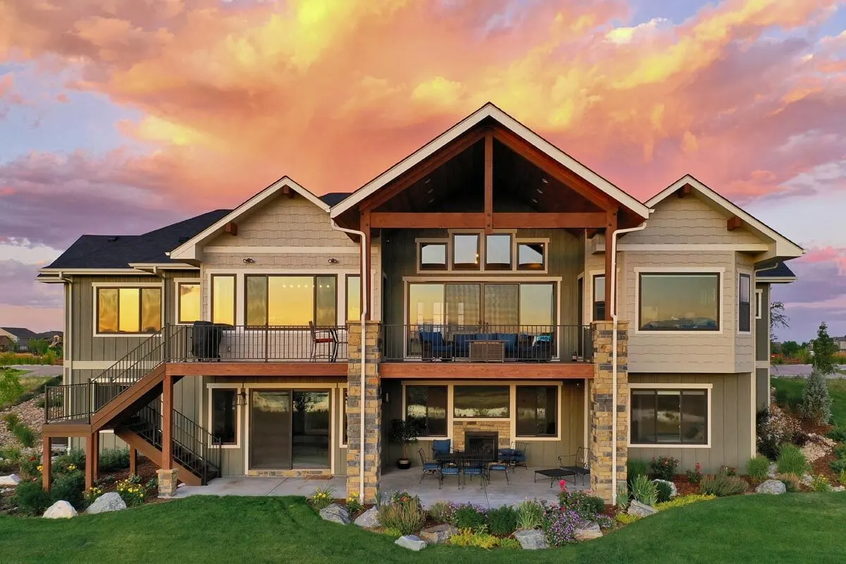 The back section of the home has a covered deck and stairs access to the gorgeous outdoors.