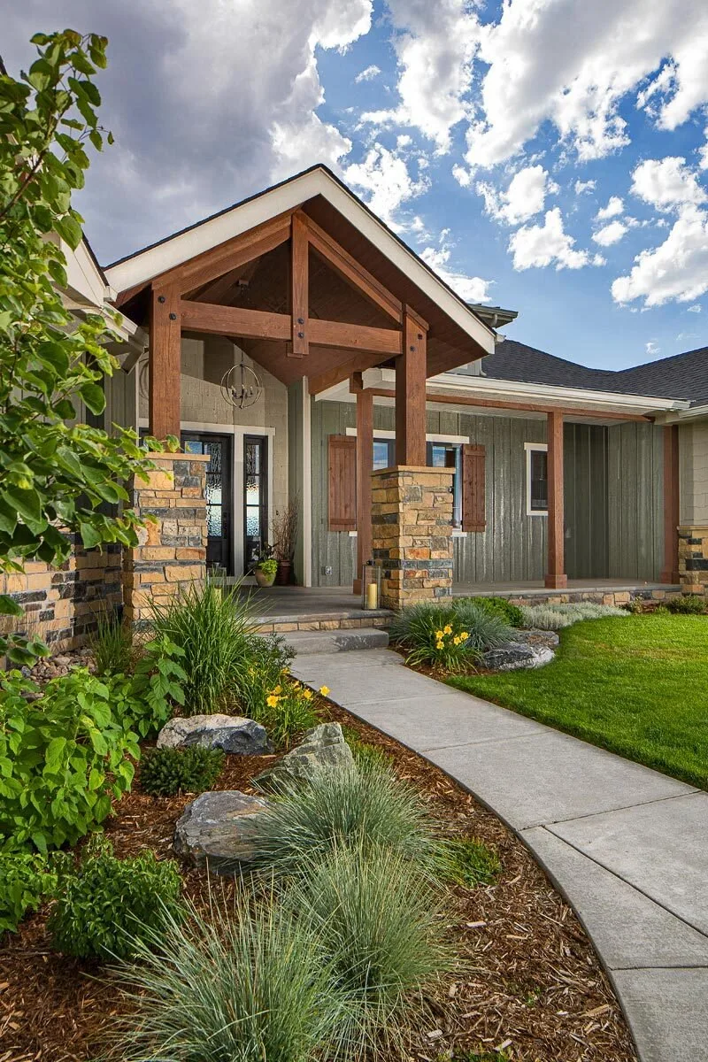 The main entrance door is black with frosted glass, making it stand out in the front area.