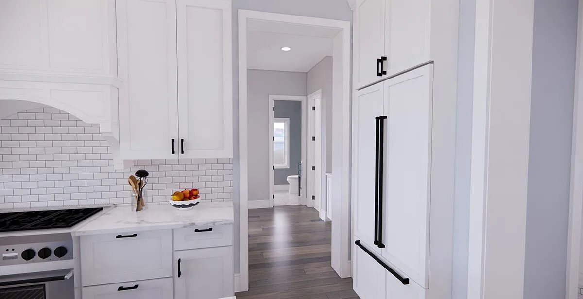 View of the hallway from the kitchen area, passing through the great room and master bathroom.