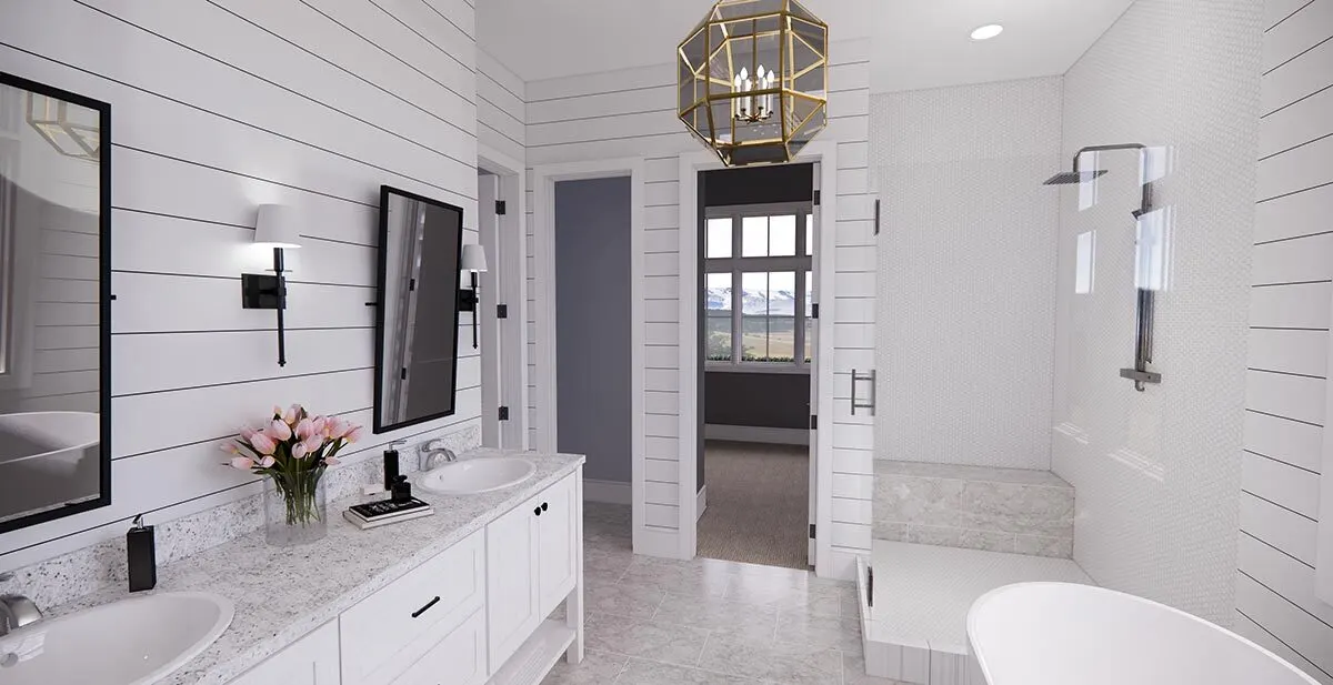 A luxurious master bathroom complete with shower, tub and vanity area.