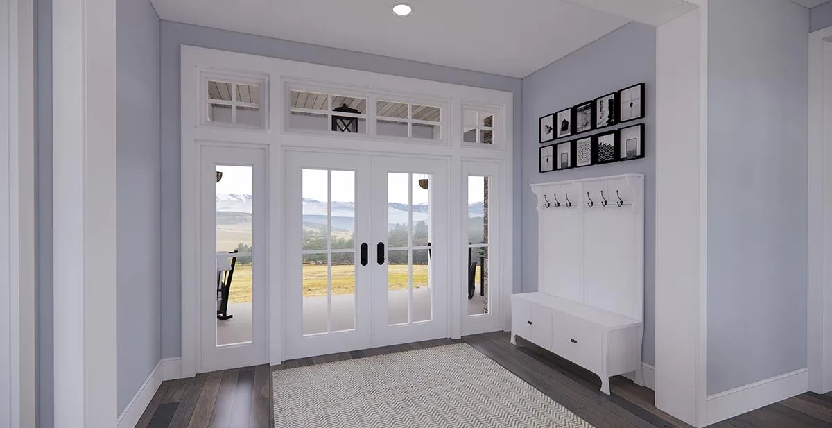 The foyer's all-white interior design appears exquisite with the presence of French doors.