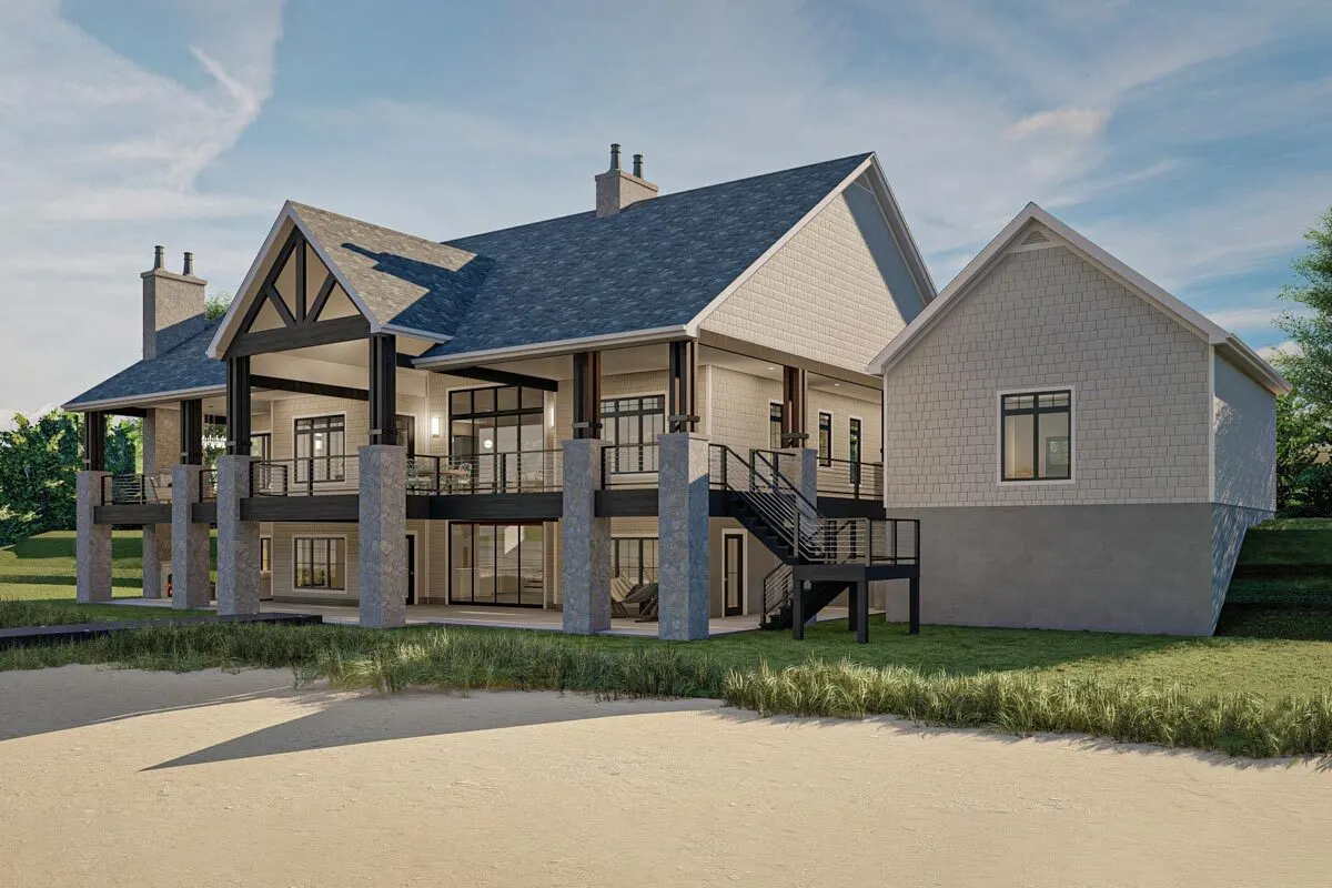 Back view of the house with an amazing wraparound porch in rustic design.