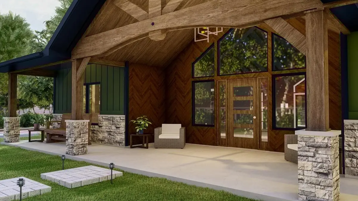A closer look at the covered porch, which features a high cathedral ceiling, beautiful stained glass work on the front wall and doors, and an overall artsy and creative aesthetic.
