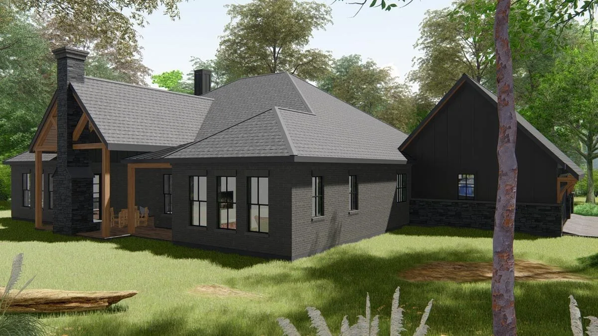 The back of the home has a large green yard.