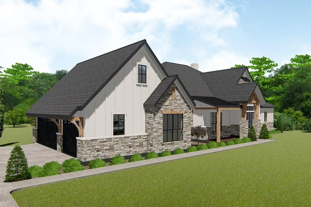 A big front yard with a stone tile path and driveway.
