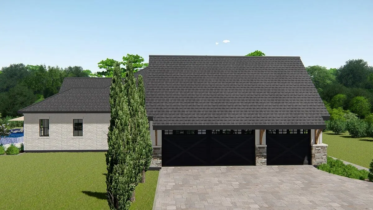 The garage space is positioned on the left side of the home, with a black barn-style door.