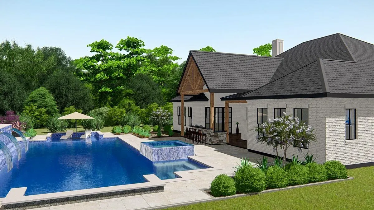 The pool area is a gorgeous blue color, furnished with a small tub and waterfalls.