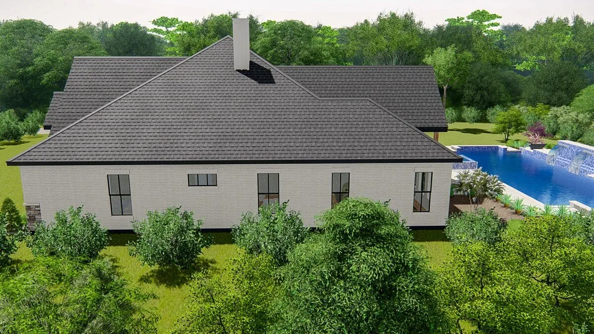 The right side of the home has a glass window in a black frame design against a white wall.