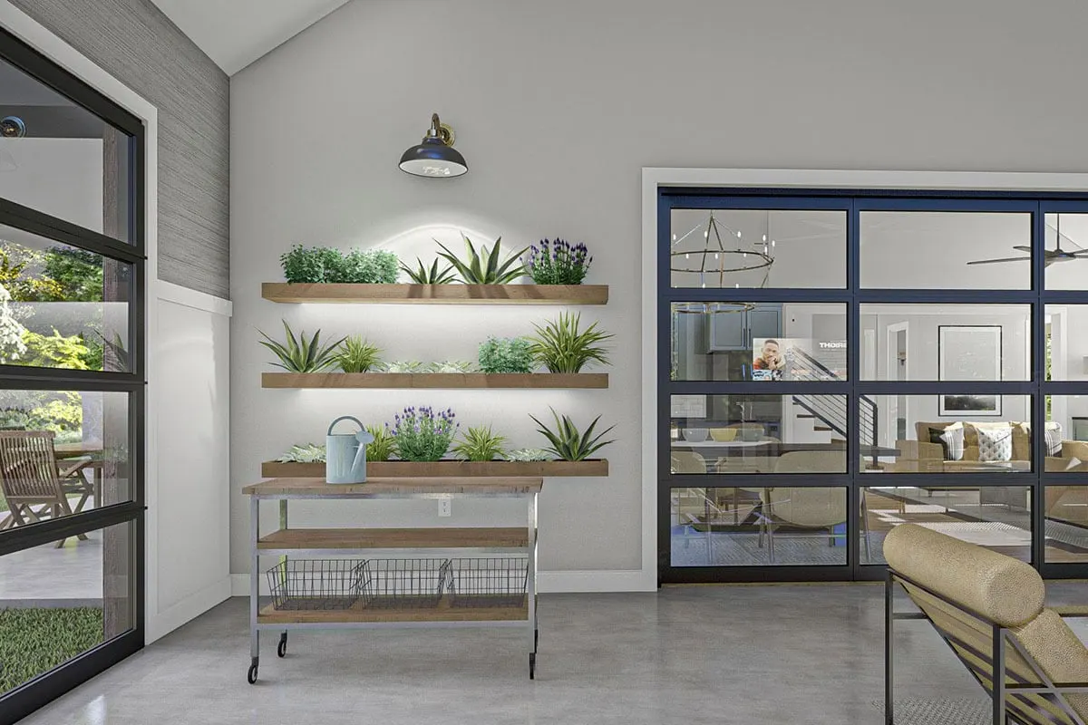 A teeny, weeny nook off the living room with a built-in cabinet, complete with a light, in which you can display houseplants.