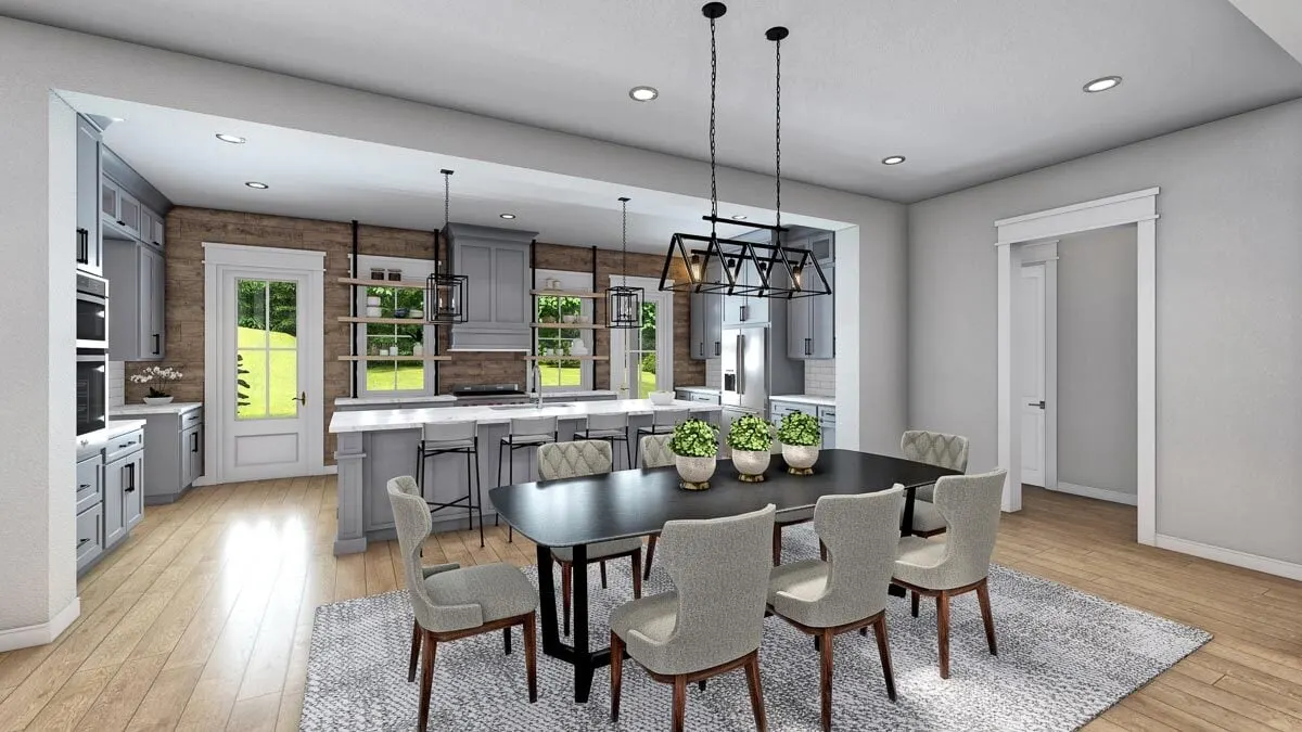 In line with the kitchen's color scheme, the dining area is directly in front of it.
