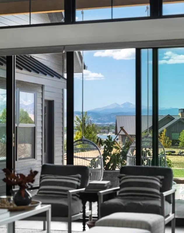 A close-up of the patio with lounge chairs and swing chairs shows that it looks to be a pleasant spot to unwind.