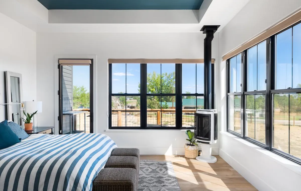 Master bedroom with a great sunlight ambiance in a suitable window and door design