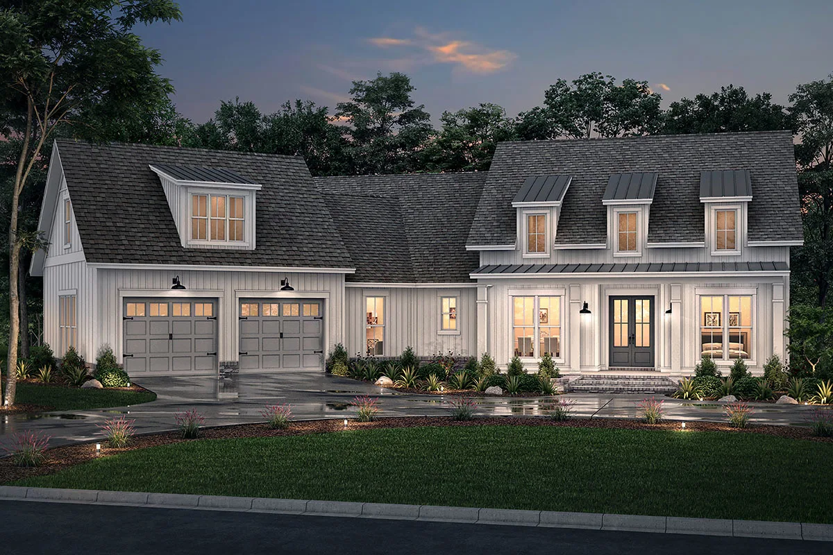 With the lights turned on, an attractive view of the farmhouse at night glows.