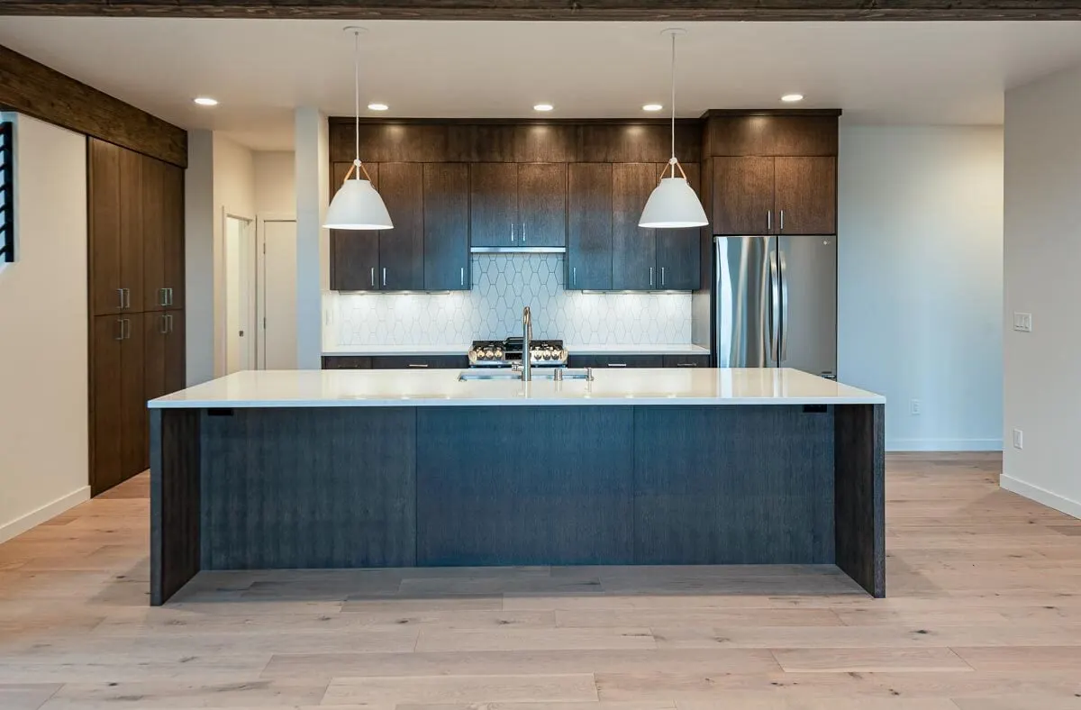 Elegant view of the kitchen area with long kitchen island.