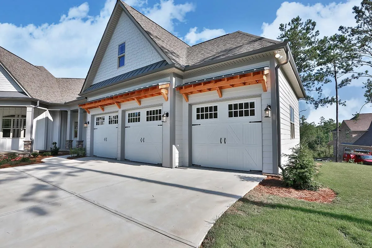 A large garage that can accommodate three cars.