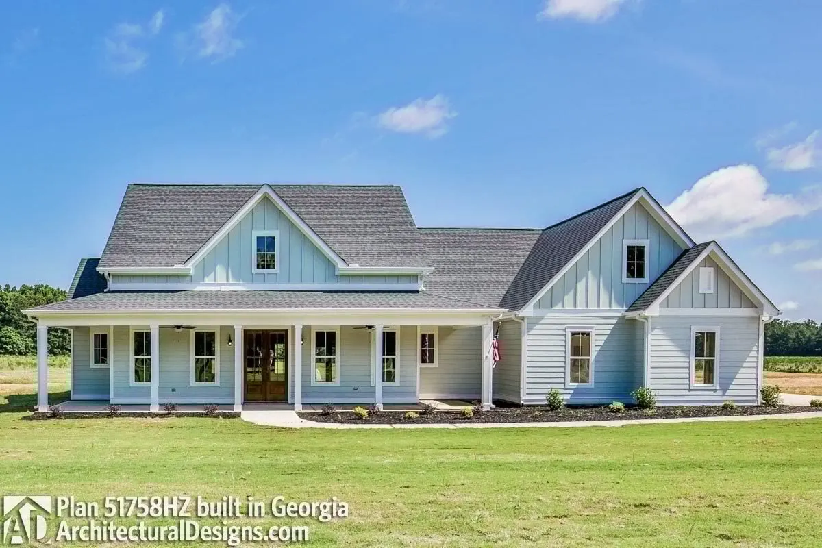 A blue painted exterior and a light gray roof adorn this contemporary farmhouse, which also features an optional additional room.