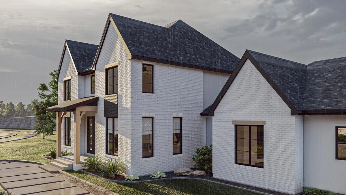The cottage house's white brick exterior style combines beautifully with the gray roof.