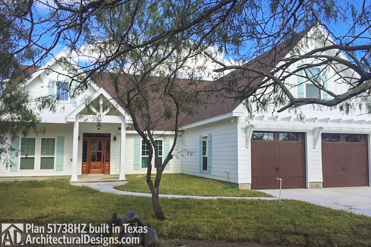 Craftsman-style home with an exterior painted in brown, white, and blue.