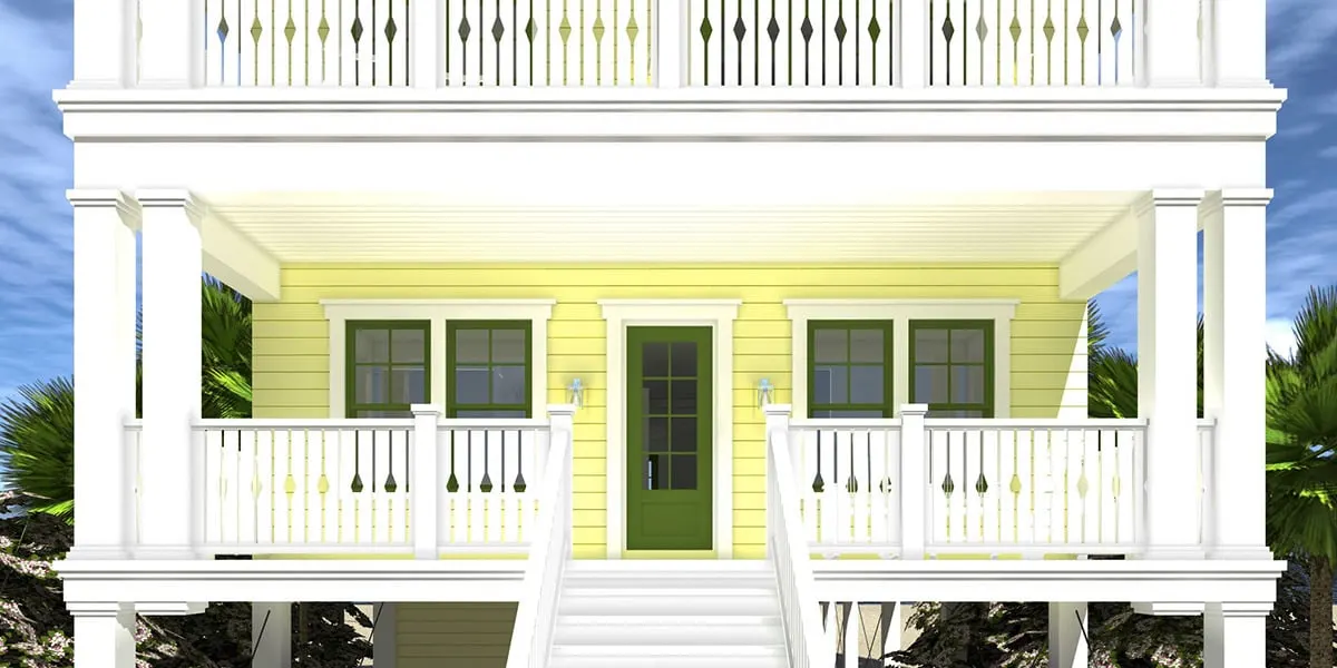 A lovely main entrance with a green door and white wooden railings on the porch.
