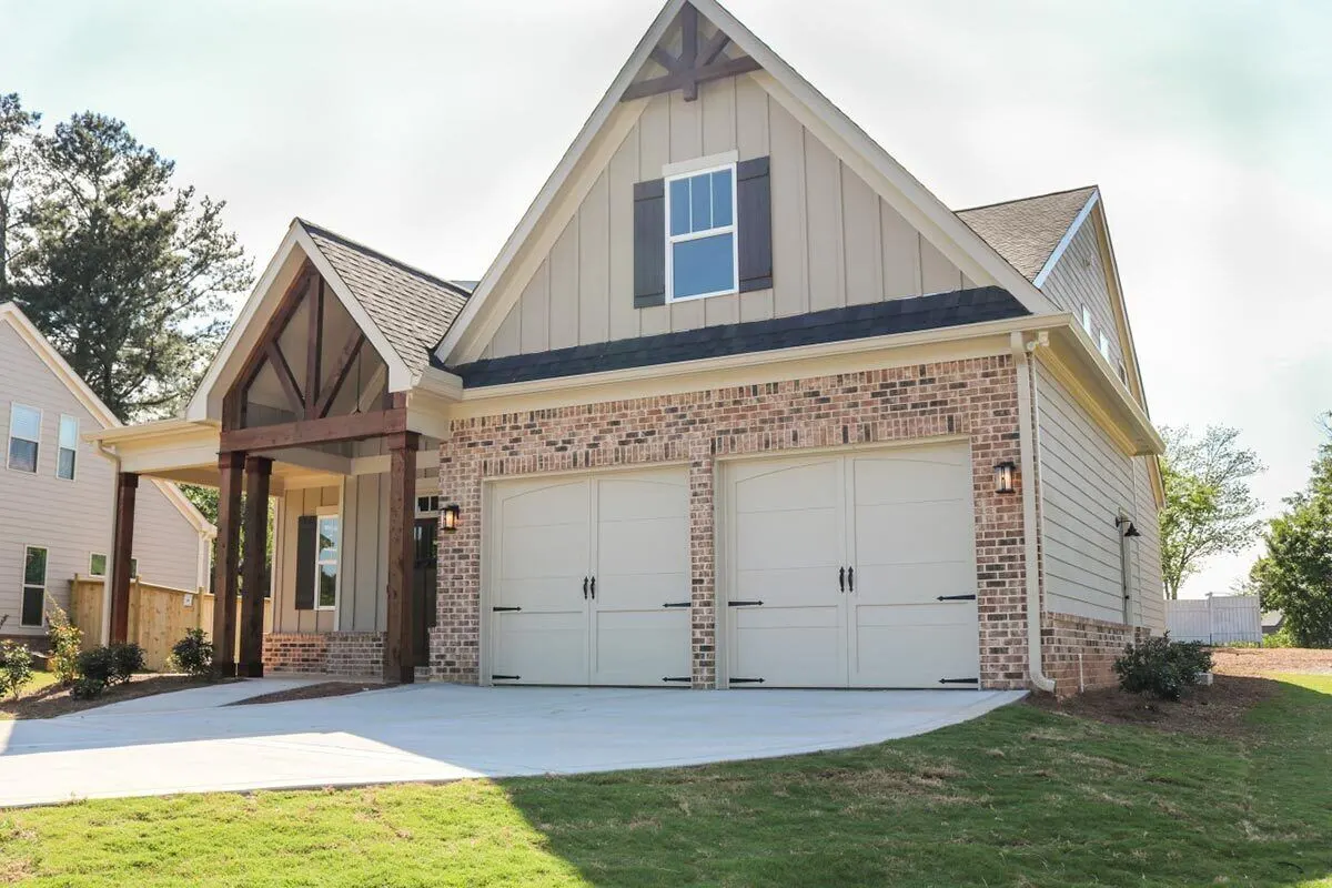 A two large brick-framed doors in the garage area.