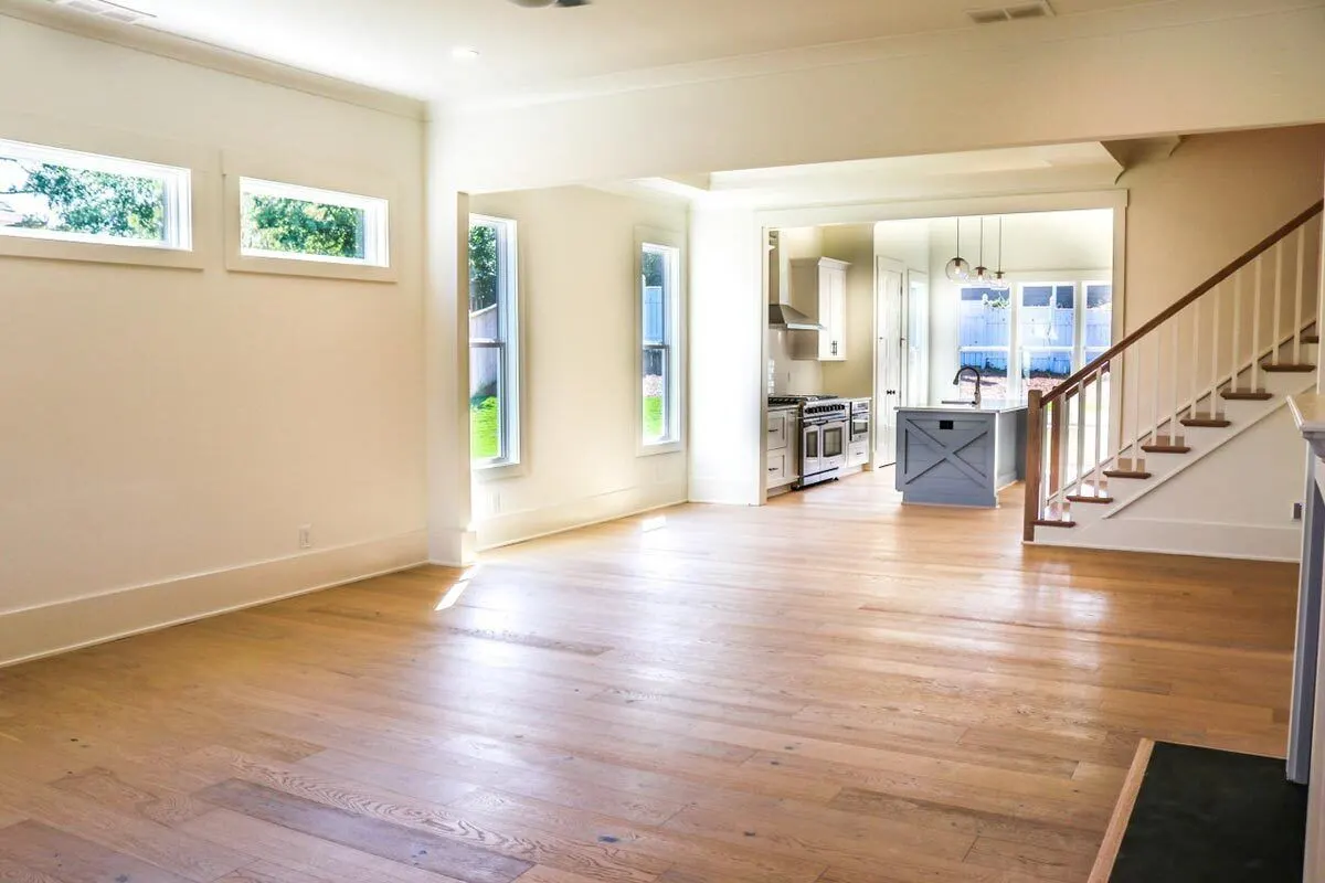 Large living space with a wooden accent floor.